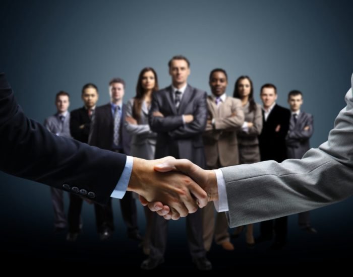 Handshake isolated on business background